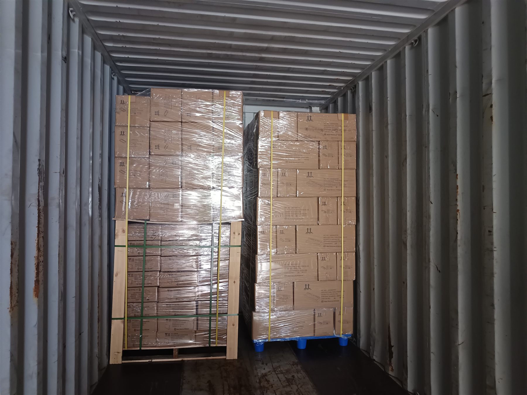 Palletized cartons loaded inside a shipping container
