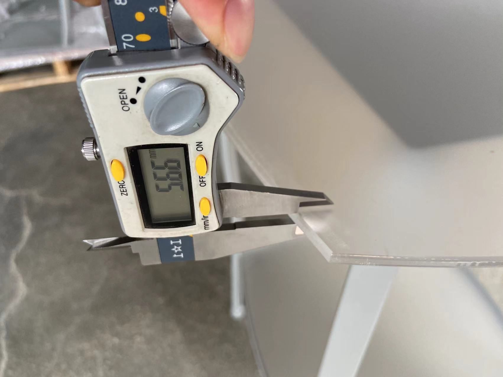 QC caliper measurement on a store fixture component